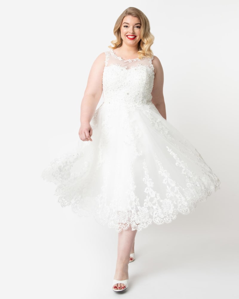 Front of a model wearing a size XL Unique Vintage Ivory Lace & Tulle Riviera Bridal Dress in White by Unique Vintage. | dia_product_style_image_id:295713